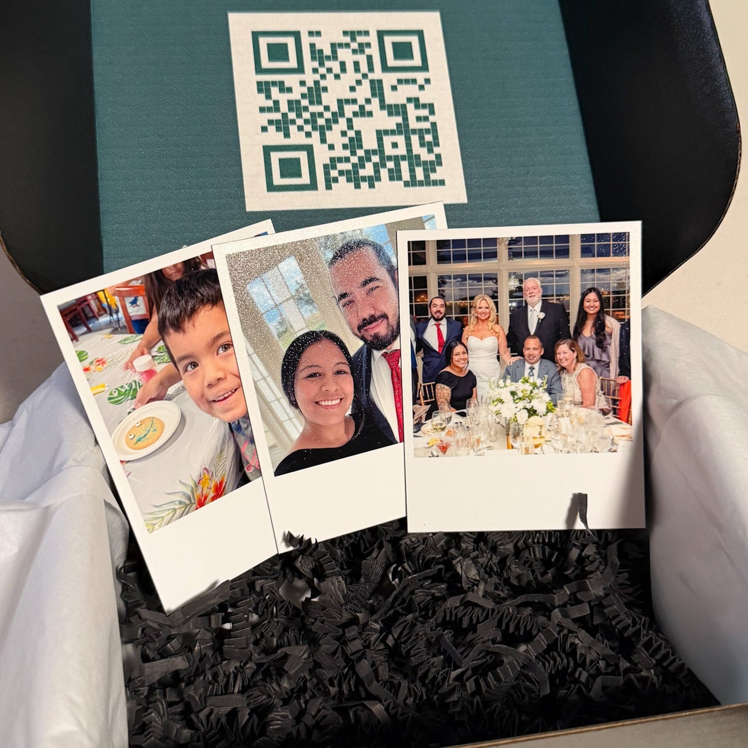 Black and dark green shipping box with a QR code. Inside contains 3 retro magnets.